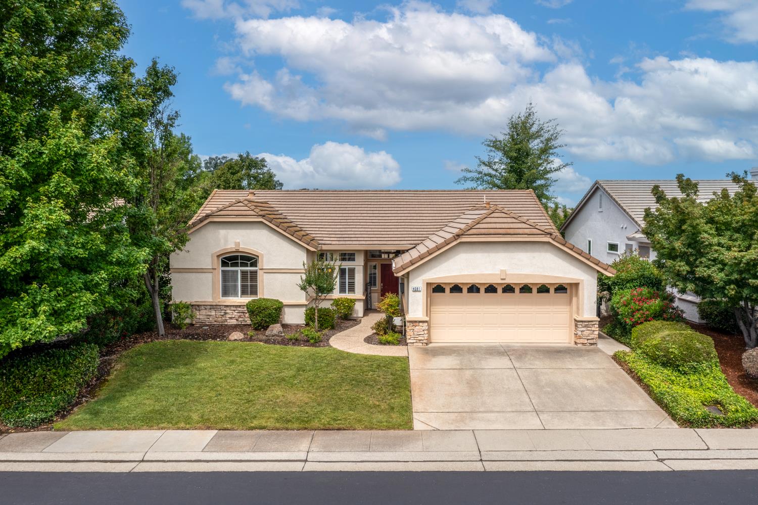 4081 Rose Creek Road Roseville, CA 95747 - Photo 49 of 52 a house with trees in front of it