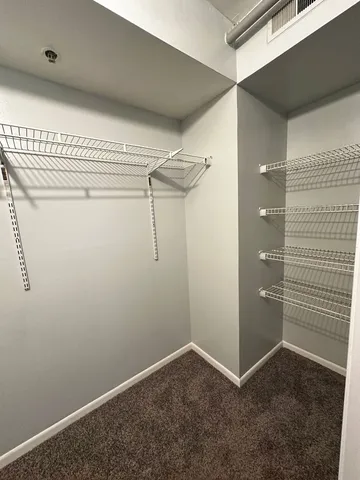 a view of a room with racks on the wall