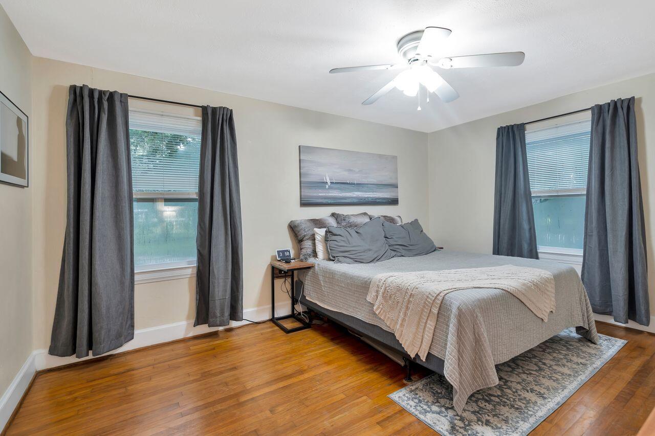 13382 Highway 20 Freeport, FL 32439 - Photo 15 of 31 a bedroom with a large bed and a chandelier