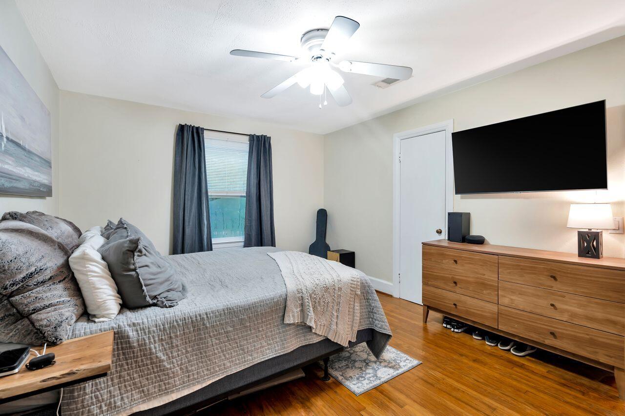 13382 Highway 20 Freeport, FL 32439 - Photo 16 of 31 a bedroom with a bed and a flat screen tv