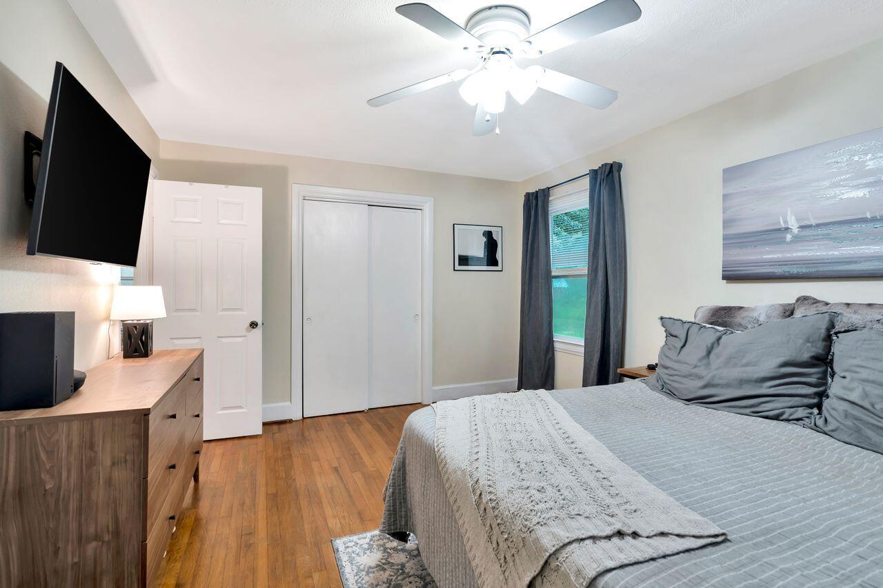 13382 Highway 20 Freeport, FL 32439 - Photo 17 of 31 a bedroom with a bed and a flat screen tv