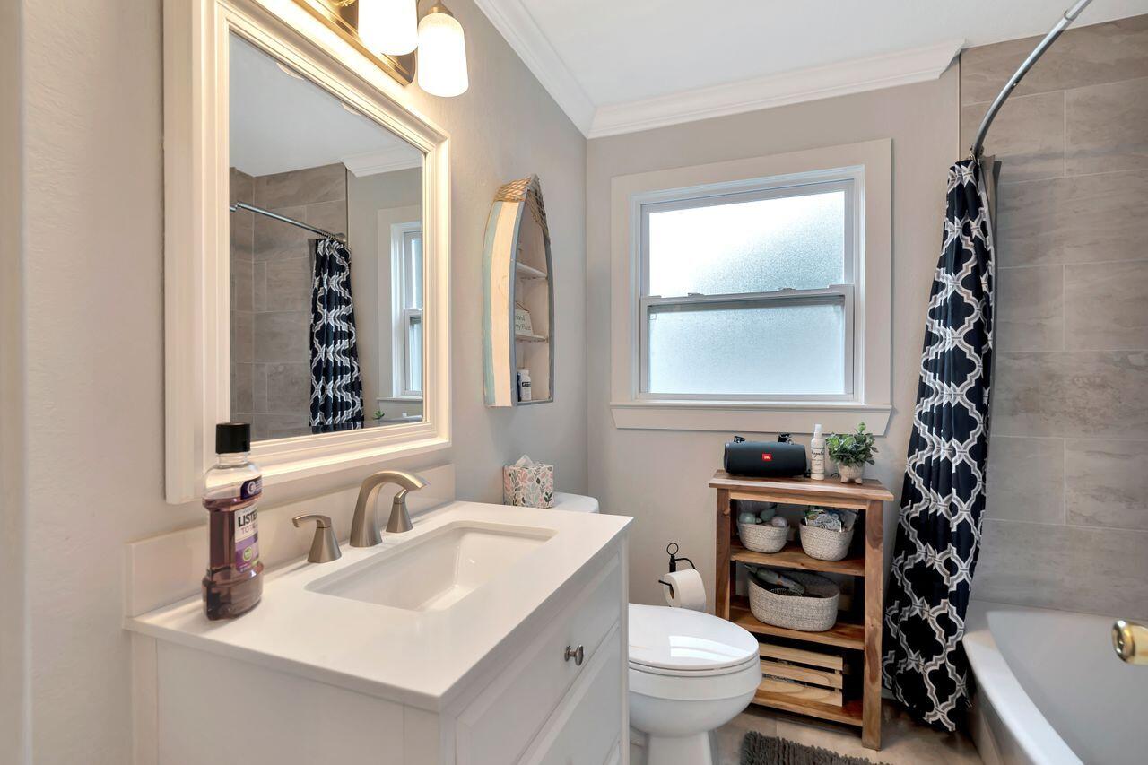 13382 Highway 20 Freeport, FL 32439 - Photo 22 of 31 a bathroom with a sink toilet vanity and mirror