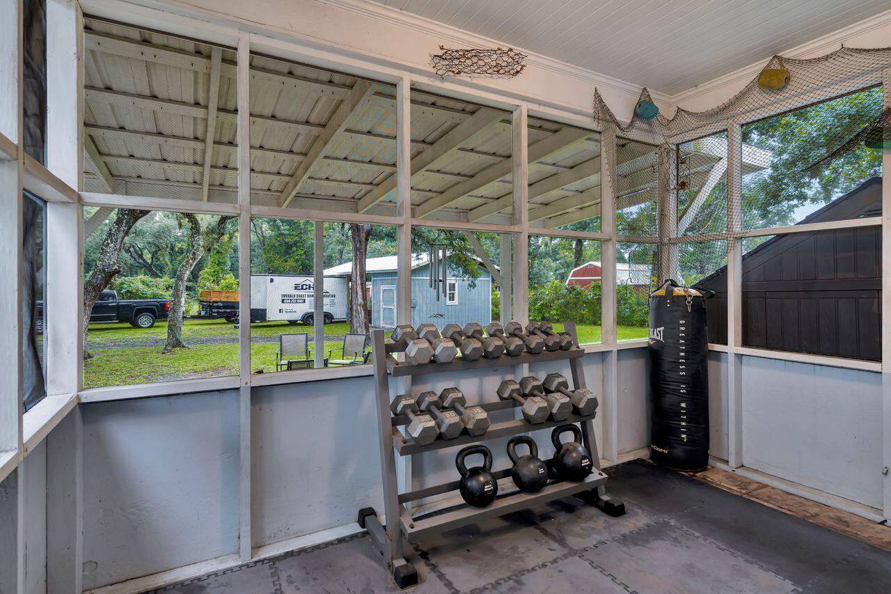 13382 Highway 20 Freeport, FL 32439 - Photo 25 of 31 a view of a garage with a table and a couch
