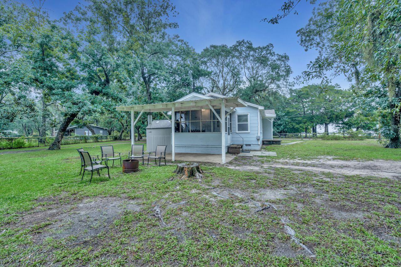 13382 Highway 20 Freeport, FL 32439 - Photo 27 of 31 a backyard of a house with table and chairs