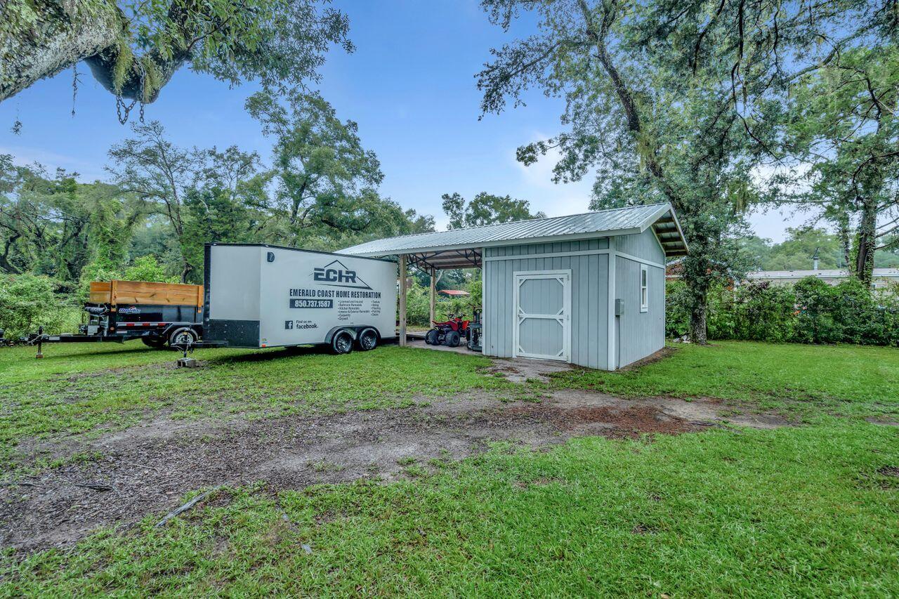 13382 Highway 20 Freeport, FL 32439 - Photo 28 of 31 a view of a barn in the middle of a yard