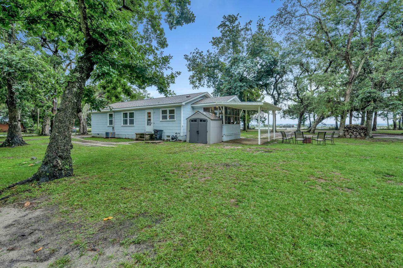 13382 Highway 20 Freeport, FL 32439 - Photo 29 of 31 a view of a house with a big yard and large trees