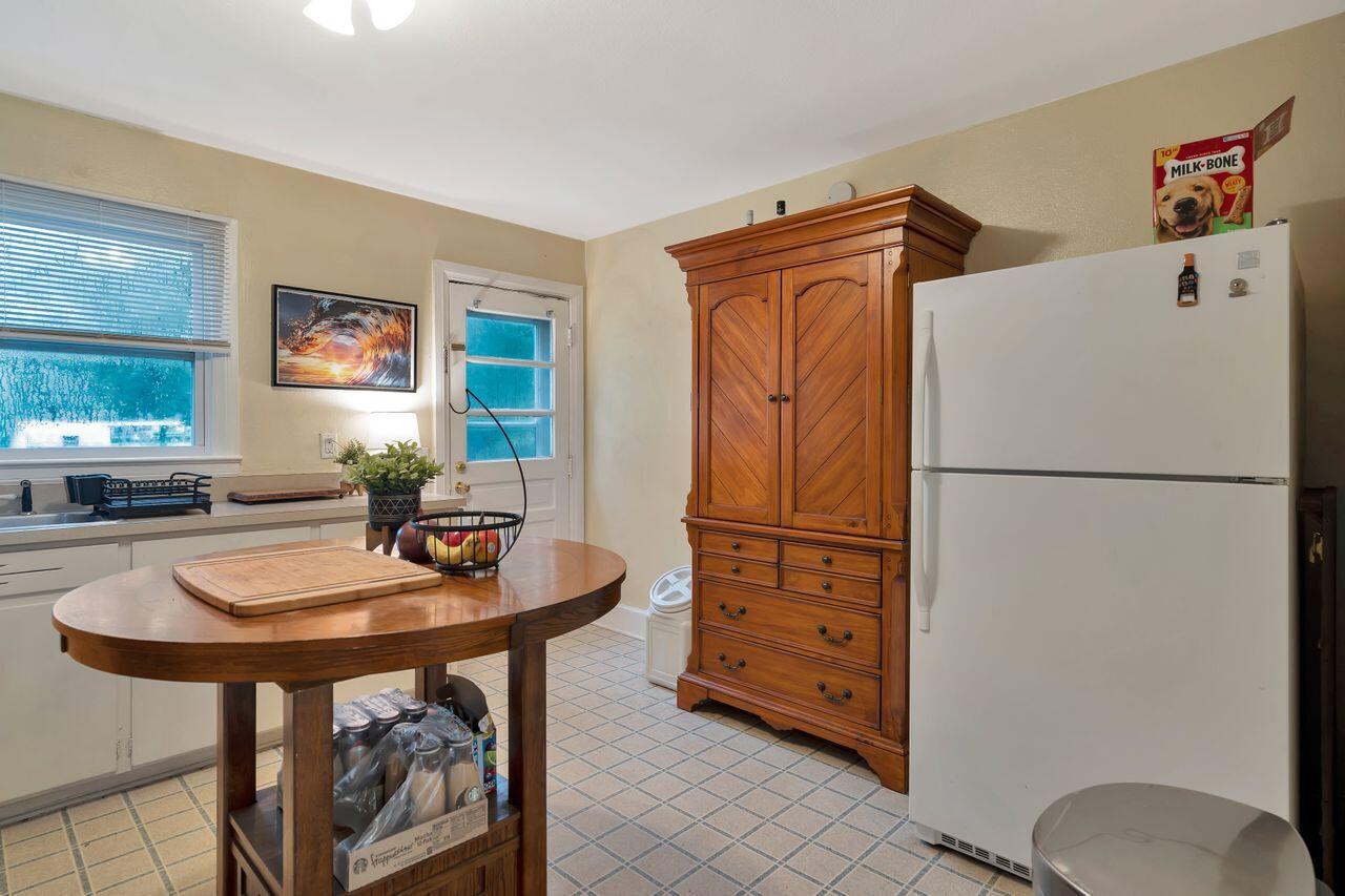 13382 Highway 20 Freeport, FL 32439 - Photo 7 of 31 a kitchen with stainless steel appliances a refrigerator and a table