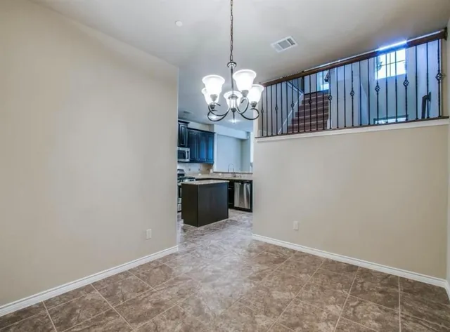 a view of a kitchen with a sink and dishwasher