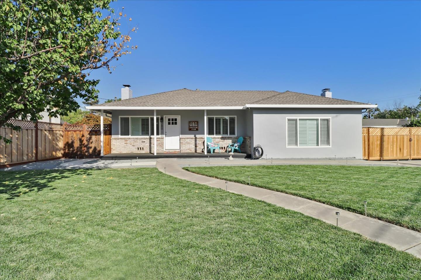 280 Dallas Drive Campbell, CA 95008 - Photo 2 of 64 a front view of a house with a yard table and chairs