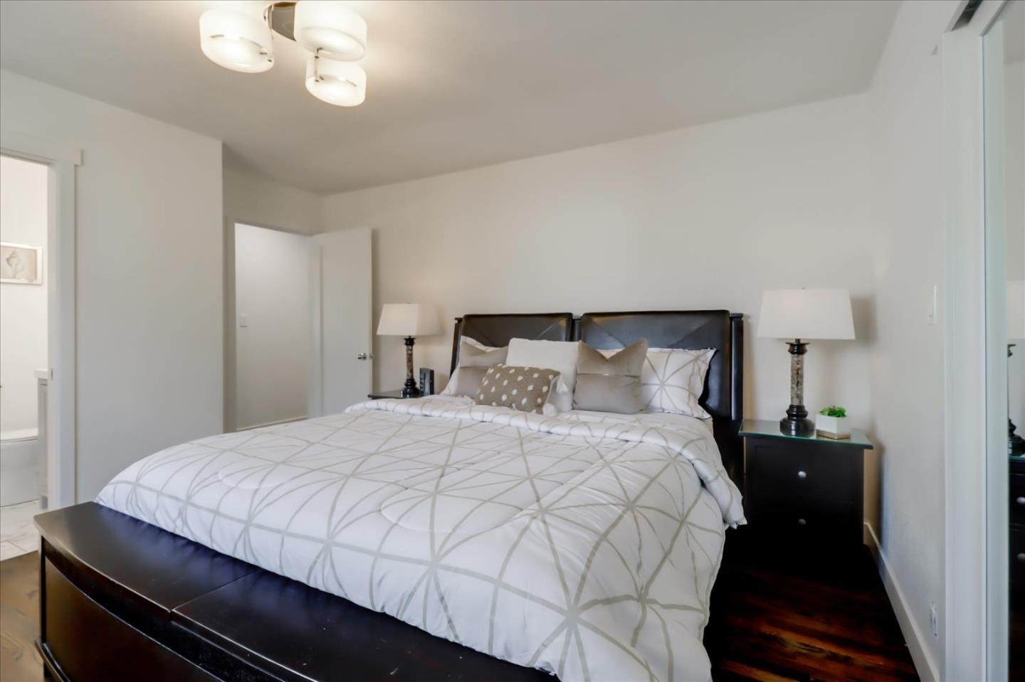 280 Dallas Drive Campbell, CA 95008 - Photo 27 of 64 a bedroom with a bed and a chandelier