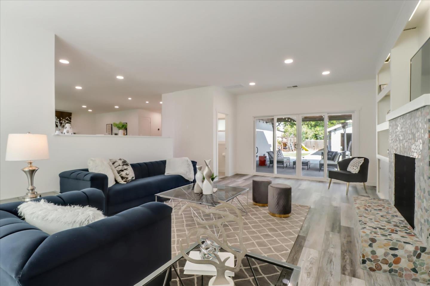 280 Dallas Drive Campbell, CA 95008 - Photo 7 of 64 a living room with furniture a flat screen tv and a fireplace