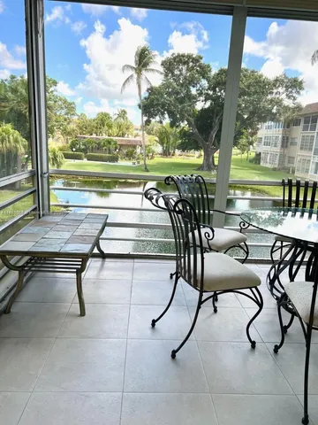 a view of a swimming pool and patio