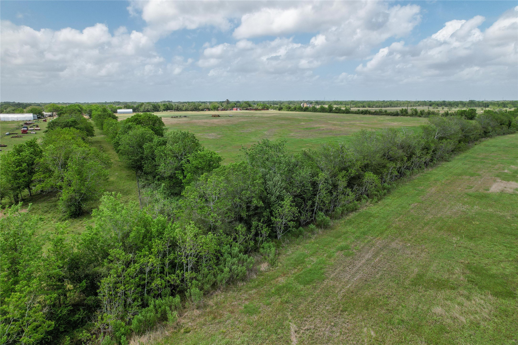 0 County Road 98 Manvel, TX 77578 - Photo 2 of 8 a view of a lake with houses in the back