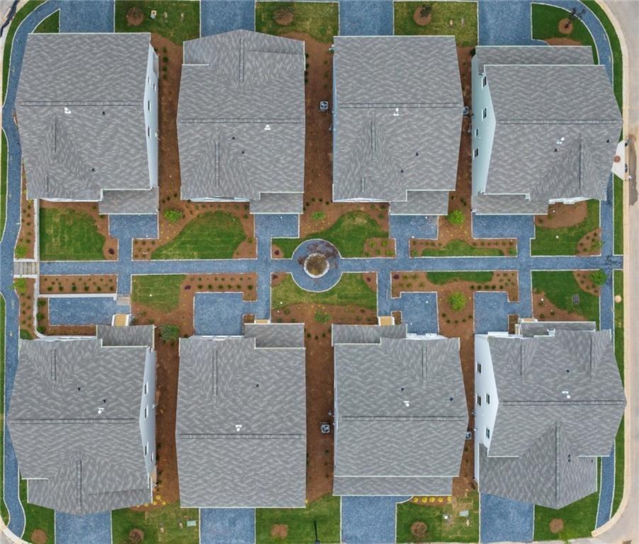 911 East Green Lane Clarkston, GA 30021 - Photo 15 of 43 an aerial view of residential houses with outdoor space and parking
