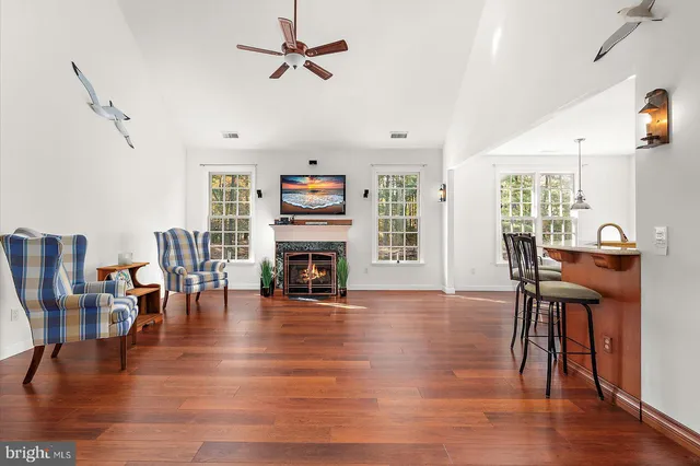 a view of kitchen with furniture and wooden floor