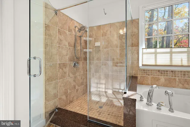 an aerial view of a house with a yard basket ball court and outdoor seating