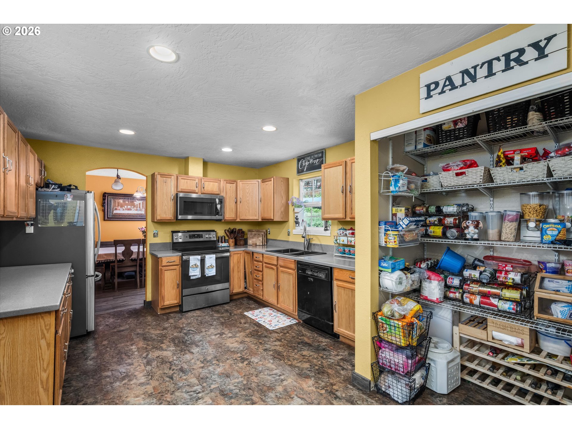 91051 Leashore Drive Vida, OR 97488 - Photo 6 of 36 a kitchen with a refrigerator and a stove top oven