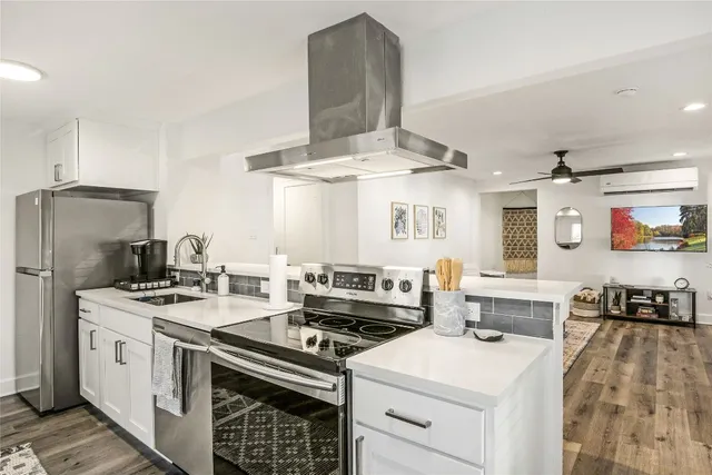 a kitchen with a stove and a refrigerator
