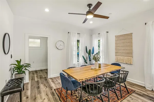 a dining room with furniture and window
