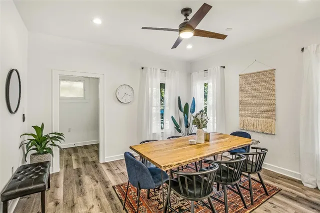 a dining room with furniture and window