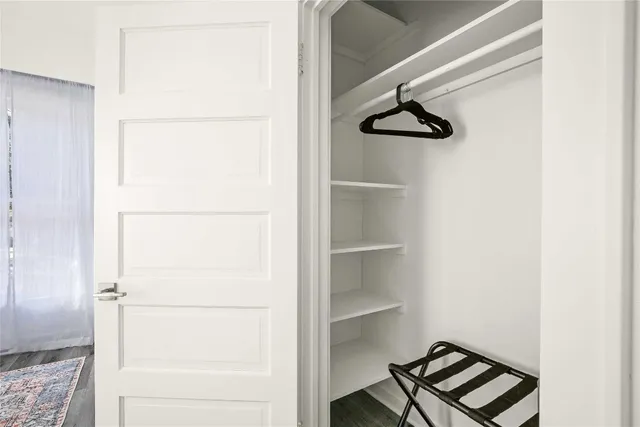 a view of staircase with white walls