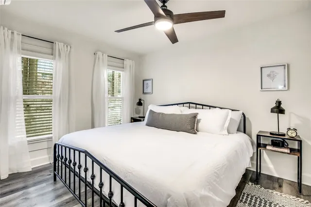 a bedroom with a bed and window