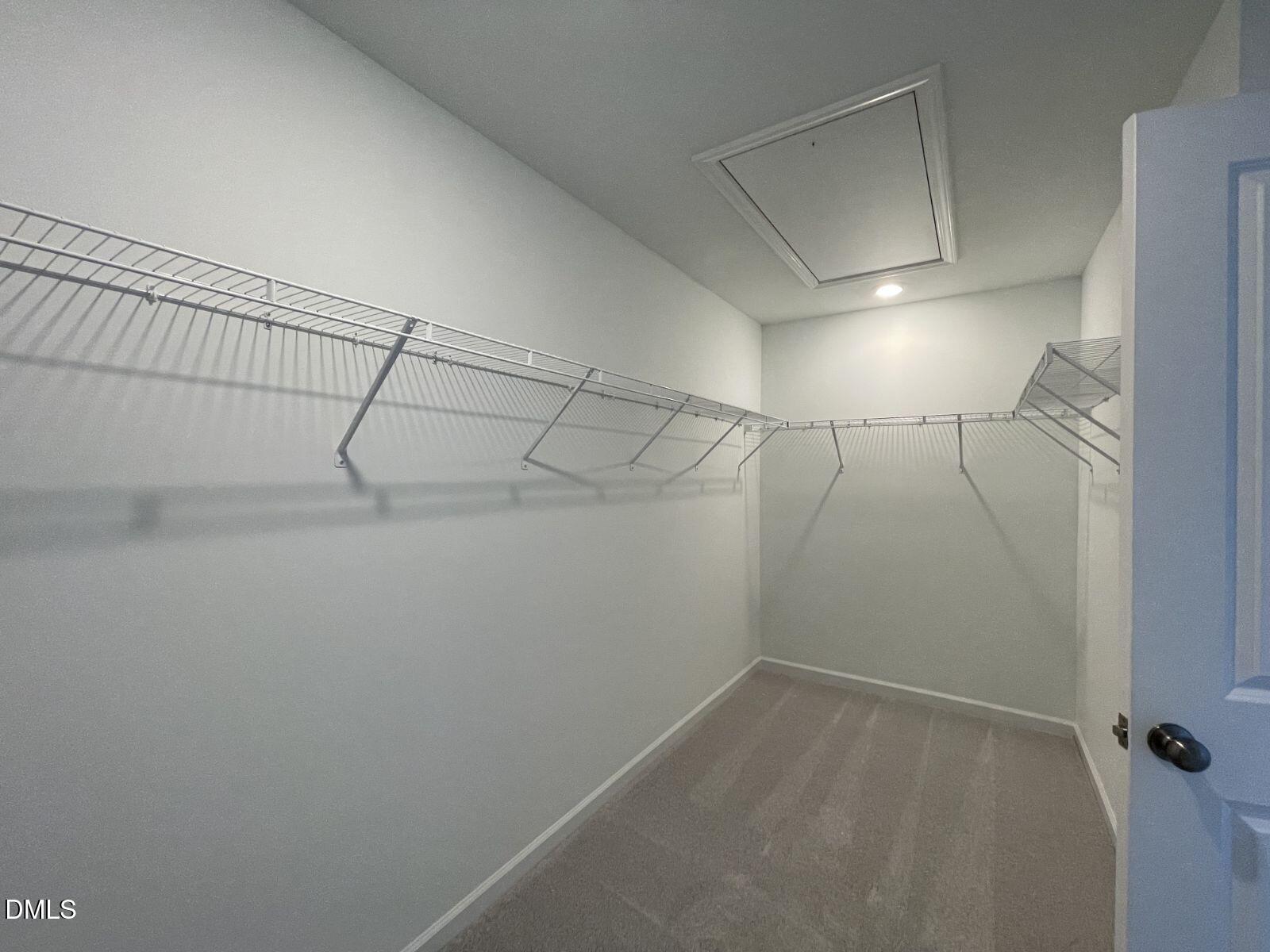 213 Lily Patch Lane Smithfield, NC 27577 - Photo 11 of 13 a view of a room with racks on the wall