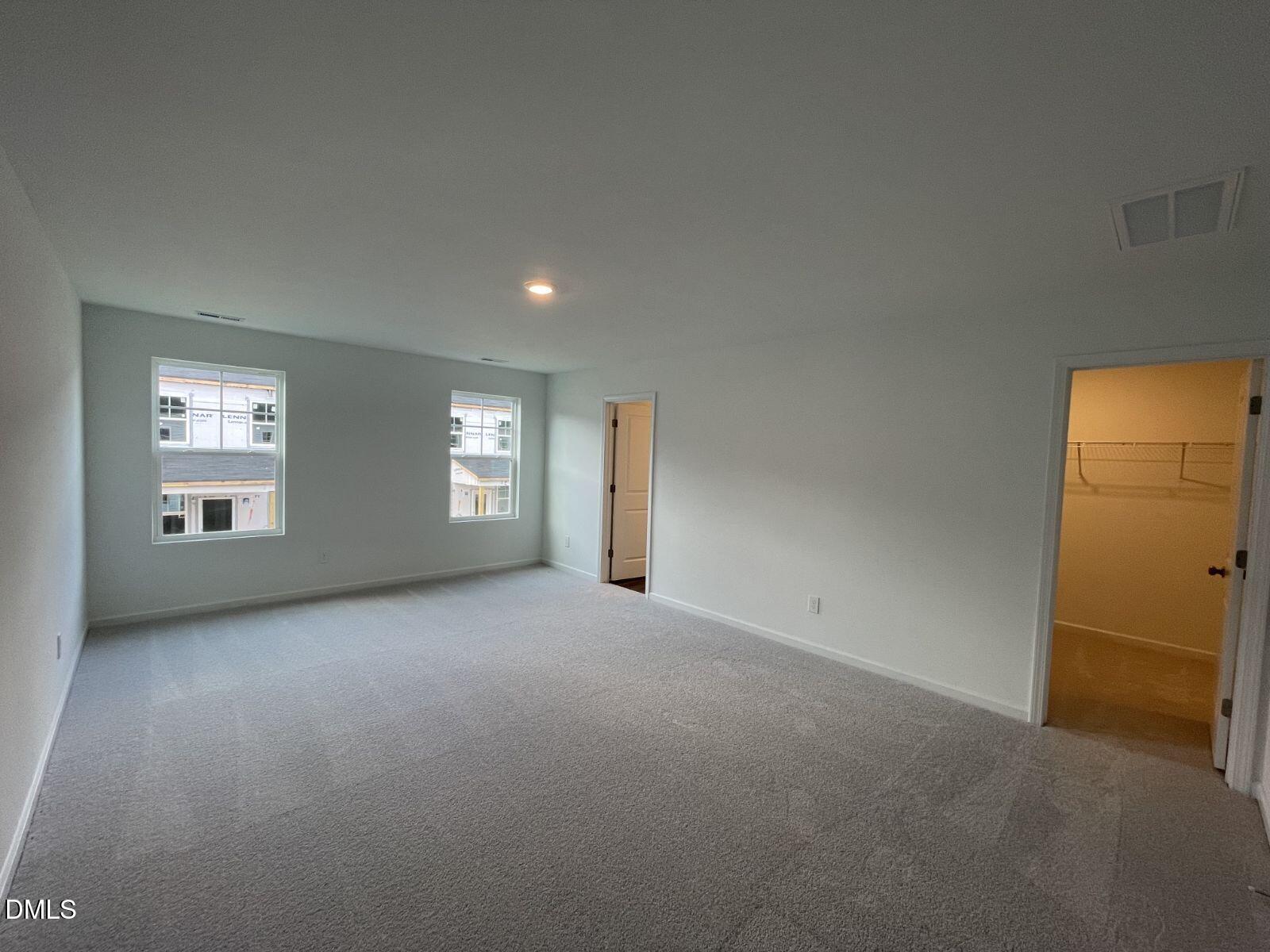 213 Lily Patch Lane Smithfield, NC 27577 - Photo 10 of 13 an empty room with windows