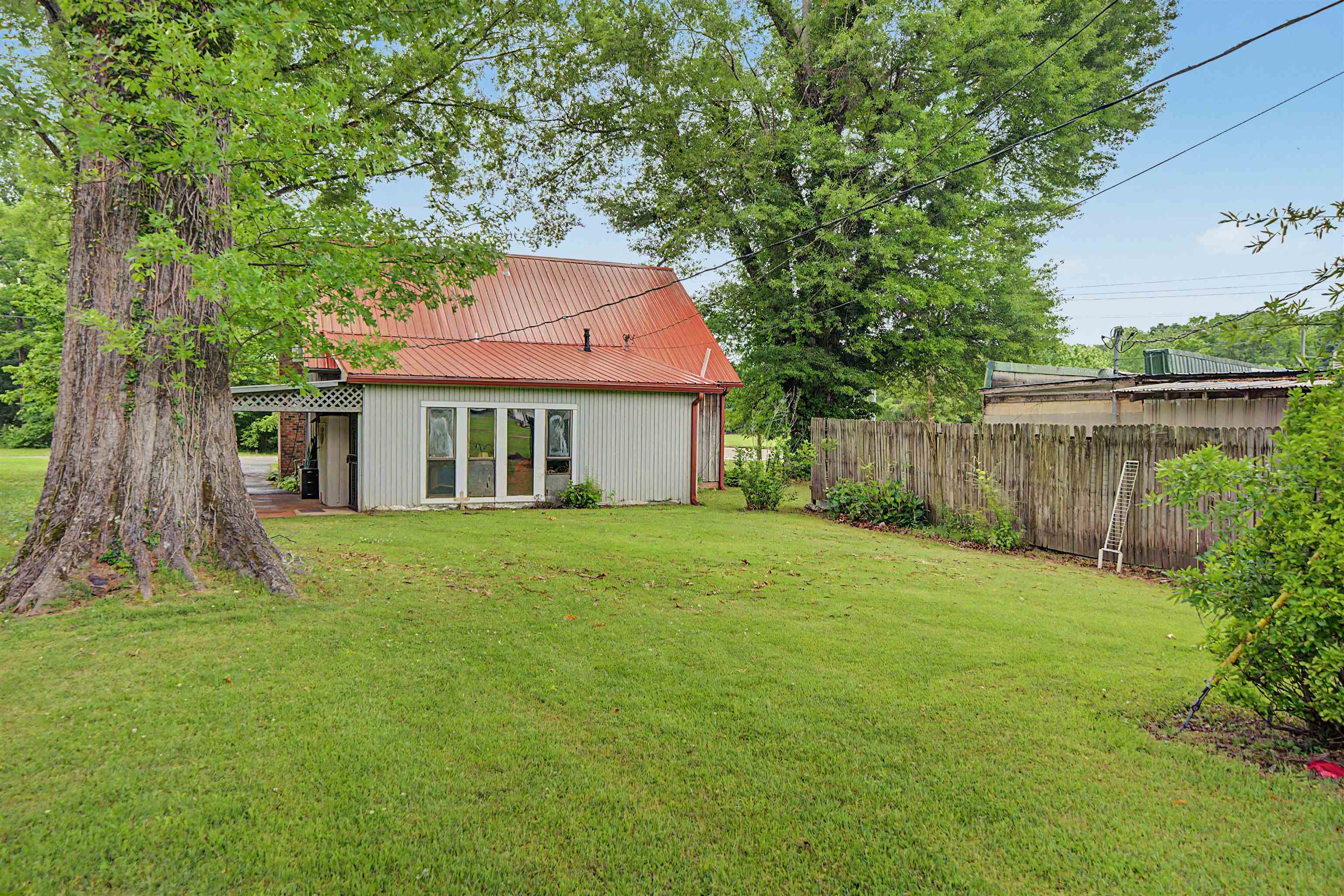 12 Baker Road Selmer, TN 38375 - Photo 12 of 28 a front view of a house with a garden