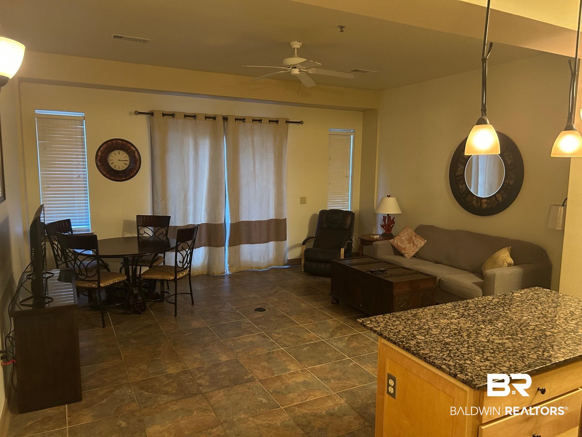 1430 Regency Road, Unit J102 Gulf Shores, AL 36542 - Photo 3 of 11 Living room with ceiling fan