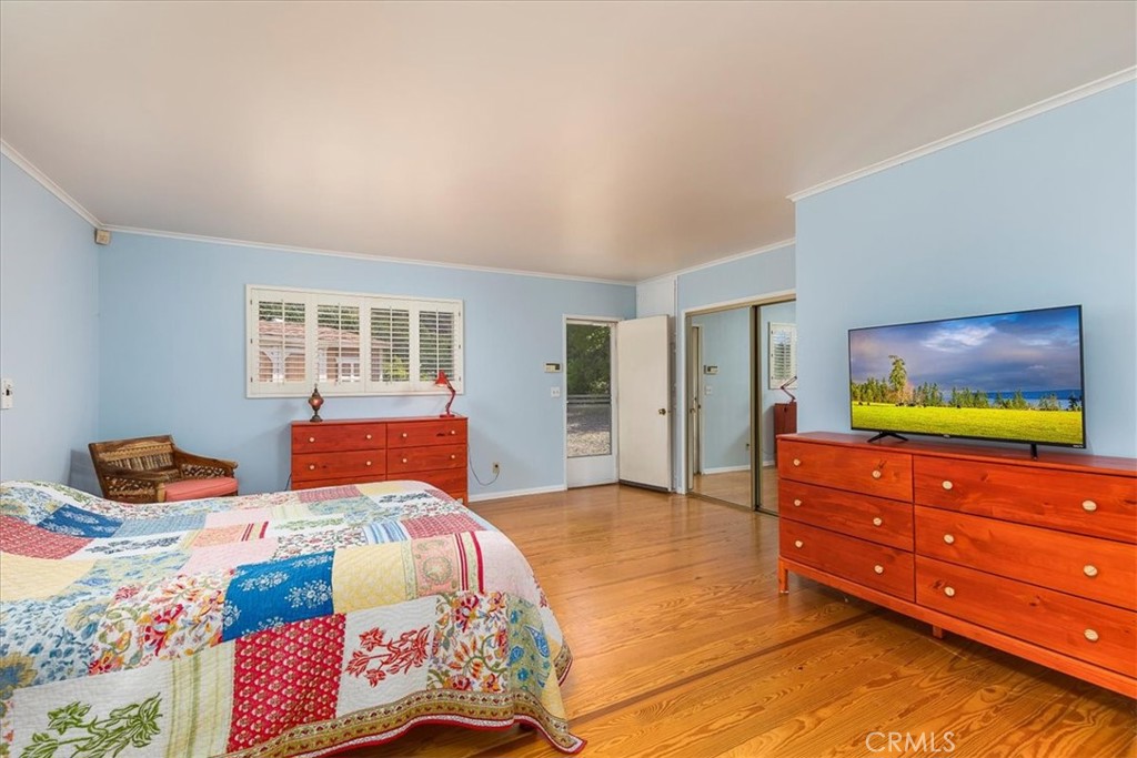40057 South Shore Drive Fallbrook, CA 92028 - Photo 13 of 53 a bedroom with a bed and a dresser in it