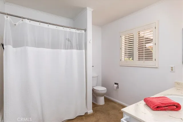 a bedroom with a bed and a desk