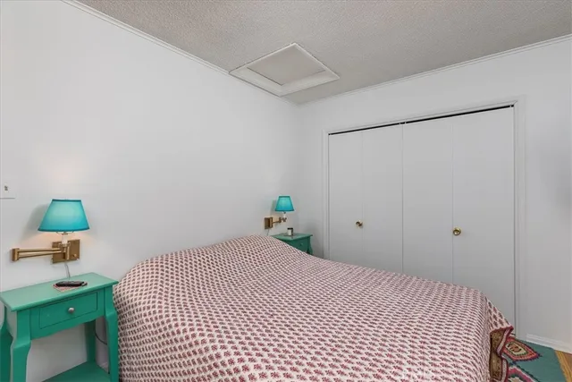 a wooden bench sitting in front of a building