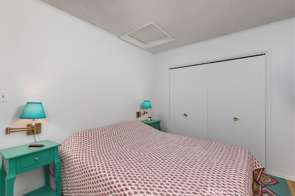 40057 South Shore Drive Fallbrook, CA 92028 - Photo 18 of 53 a bedroom with a bed and a desk