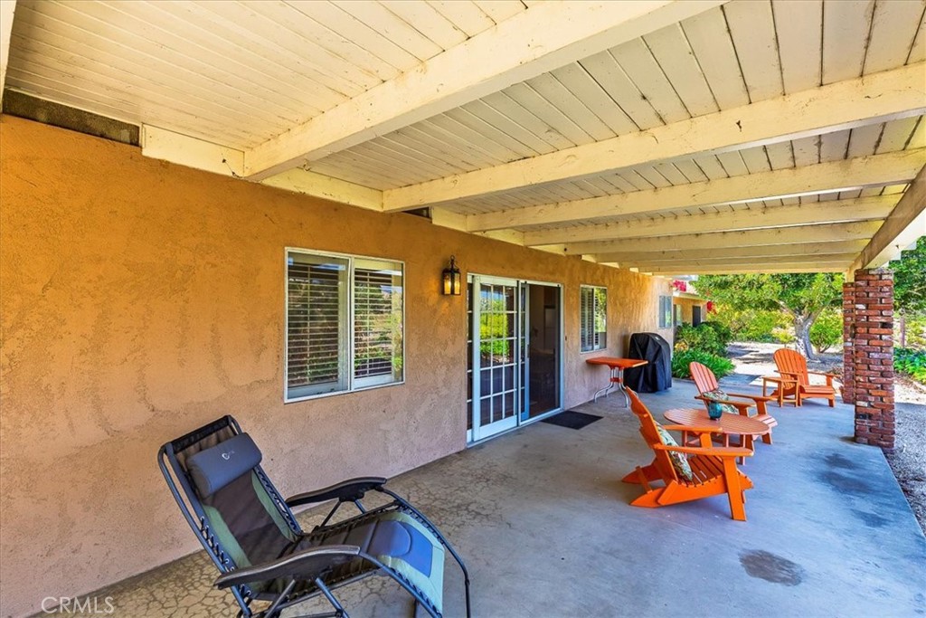 40057 South Shore Drive Fallbrook, CA 92028 - Photo 19 of 53 a wooden bench sitting in front of a building