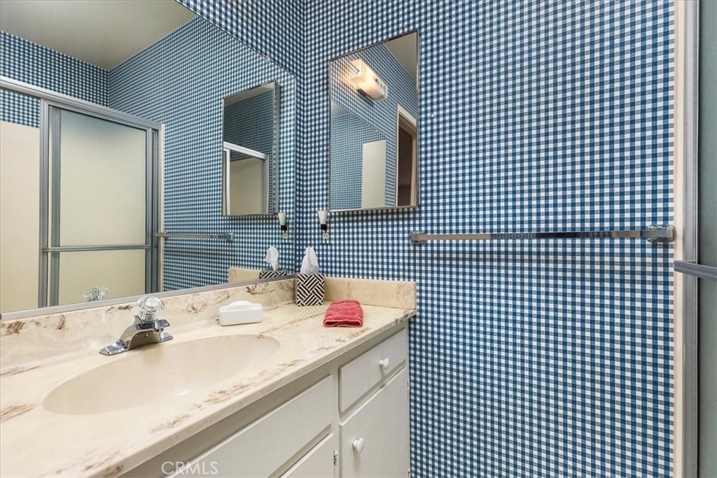 40057 South Shore Drive Fallbrook, CA 92028 - Photo 28 of 53 a bathroom with a sink and a mirror