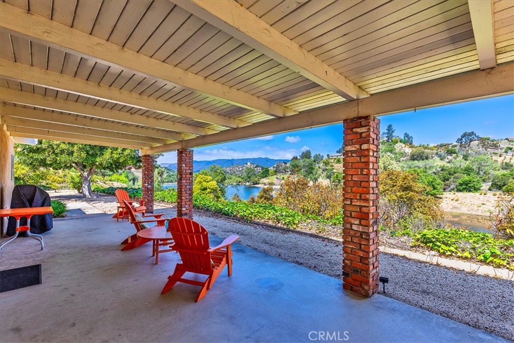 40057 South Shore Drive Fallbrook, CA 92028 - Photo 3 of 53 a living room with patio furniture and a floor to ceiling window