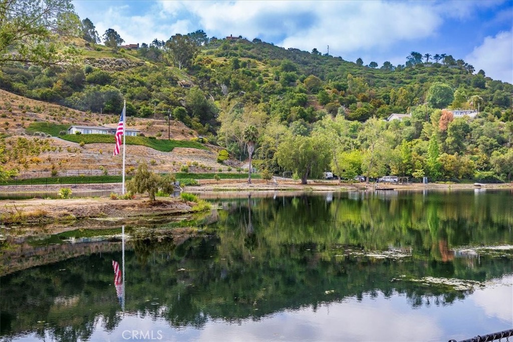 40057 South Shore Drive Fallbrook, CA 92028 - Photo 41 of 53 a view of a lake with a house in the background