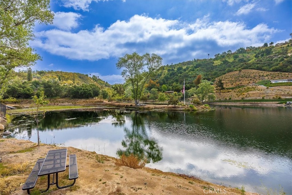 40057 South Shore Drive Fallbrook, CA 92028 - Photo 42 of 53 a view of a lake with houses in the back