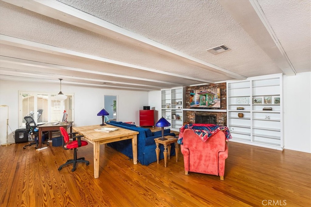 40057 South Shore Drive Fallbrook, CA 92028 - Photo 6 of 53 a living room filled with furniture and a wooden floor