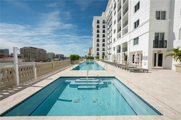 a view of a room with furniture and wooden floor