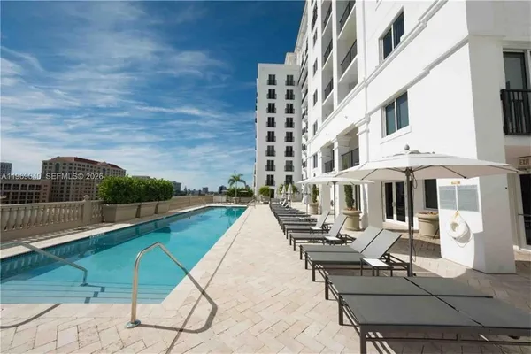 a view of swimming pool from a balcony