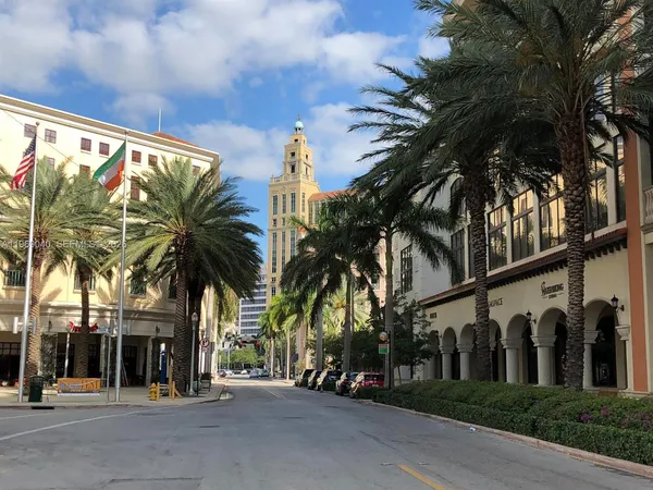 a view of a swimming pool with chairs in patio