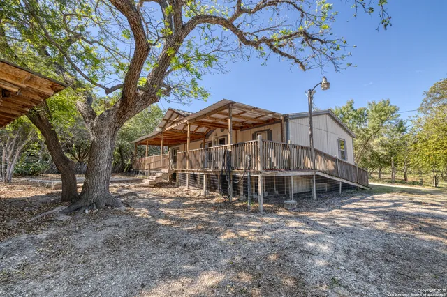 a view of a yard with a tree