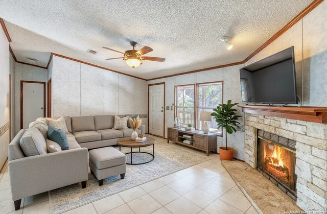 a view of an empty room with a fireplace