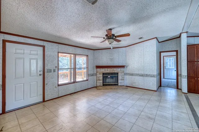 a kitchen with a stove a refrigerator and a stove top oven