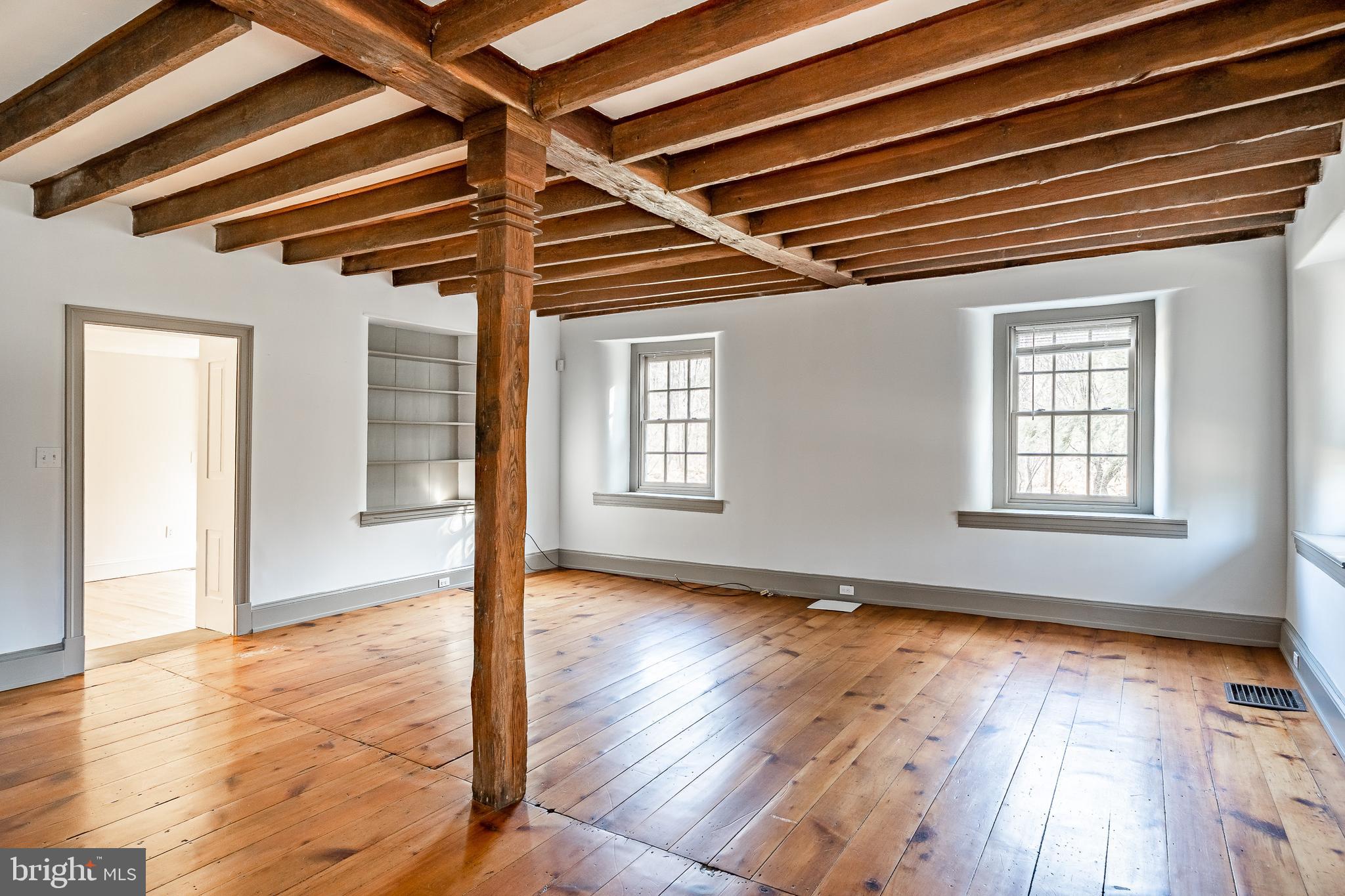 768 Forgedale Road Barto, PA 19504 - Photo 11 of 49 a view of an empty room with wooden floor and a window
