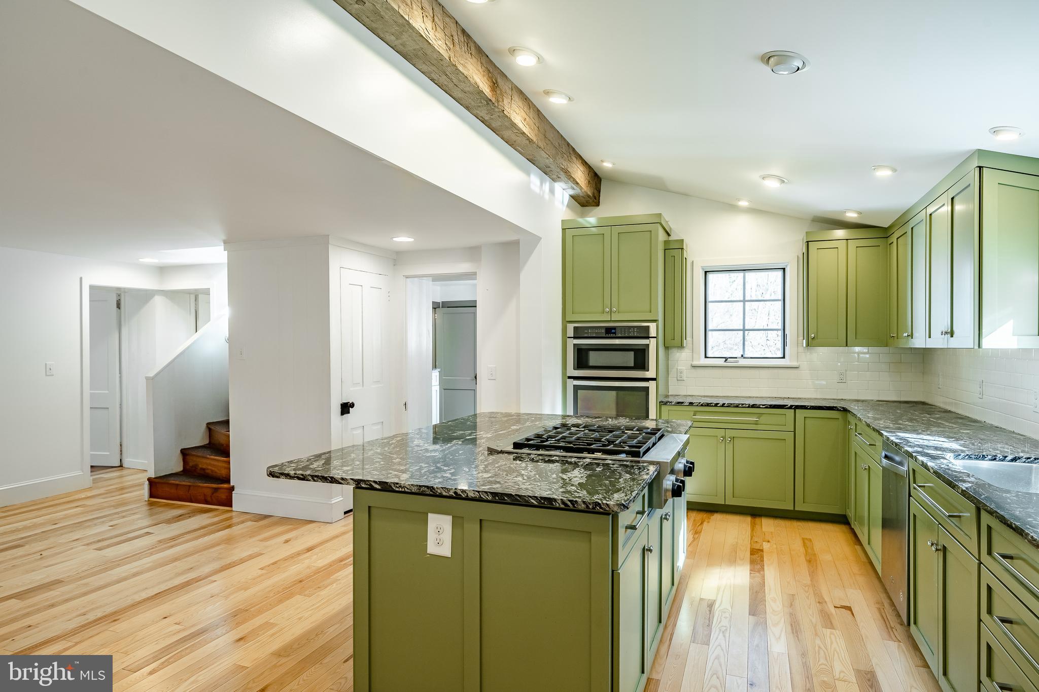 768 Forgedale Road Barto, PA 19504 - Photo 17 of 49 a kitchen with granite countertop a sink stove and cabinets