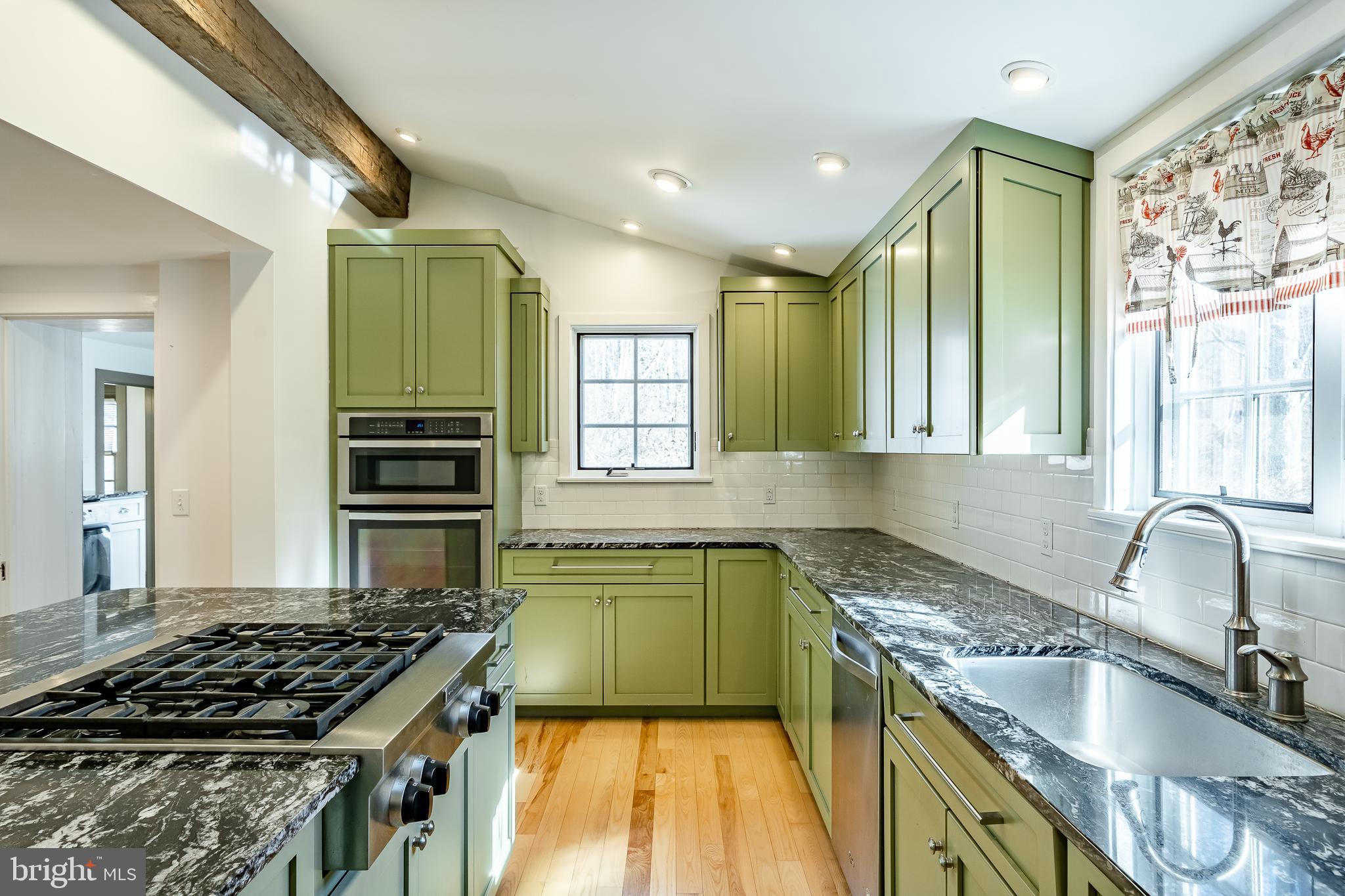 768 Forgedale Road Barto, PA 19504 - Photo 18 of 49 a kitchen with a sink stove top oven and cabinets