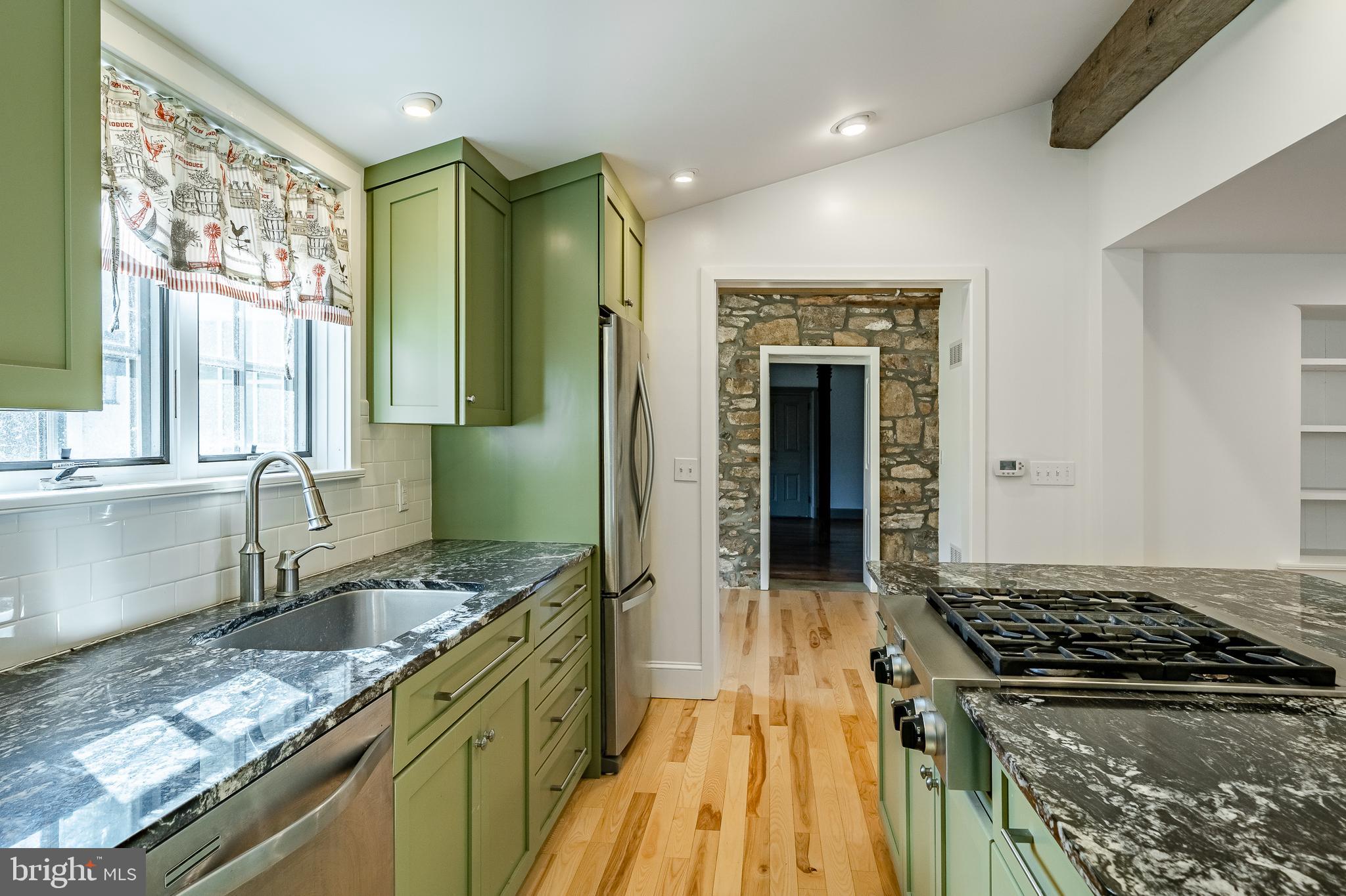 768 Forgedale Road Barto, PA 19504 - Photo 19 of 49 a kitchen with granite countertop a sink stove and cabinets